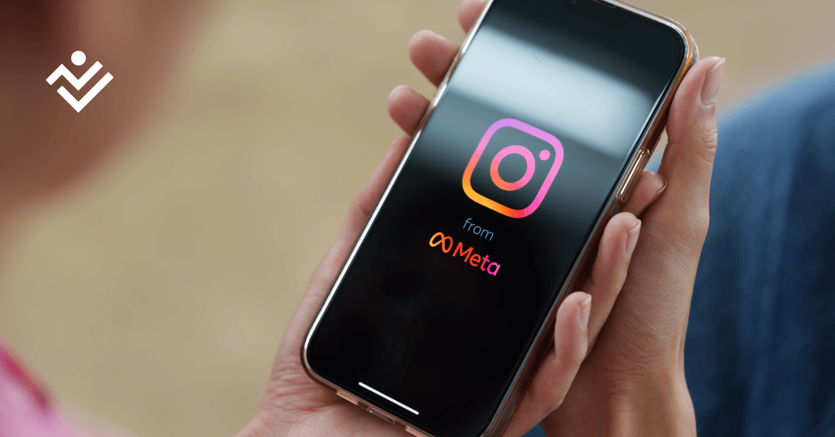 Hand holding cell phone that shows Instagram logo. 10 tips to get you started on Instagram